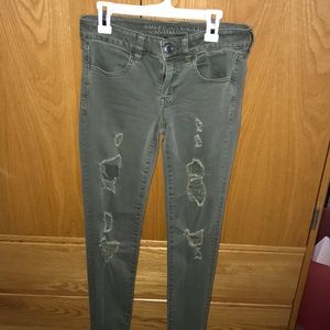 Distressed army green jeans